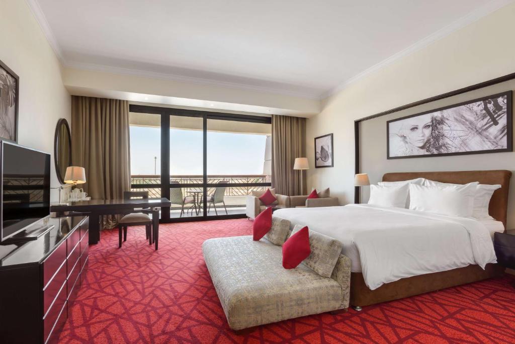 A bed or beds in a room at Radisson Blu Hotel & Convention Center, Alexandria