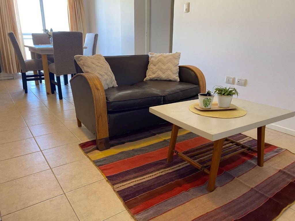 a living room with a couch and a coffee table at DESPERTAR in San Luis