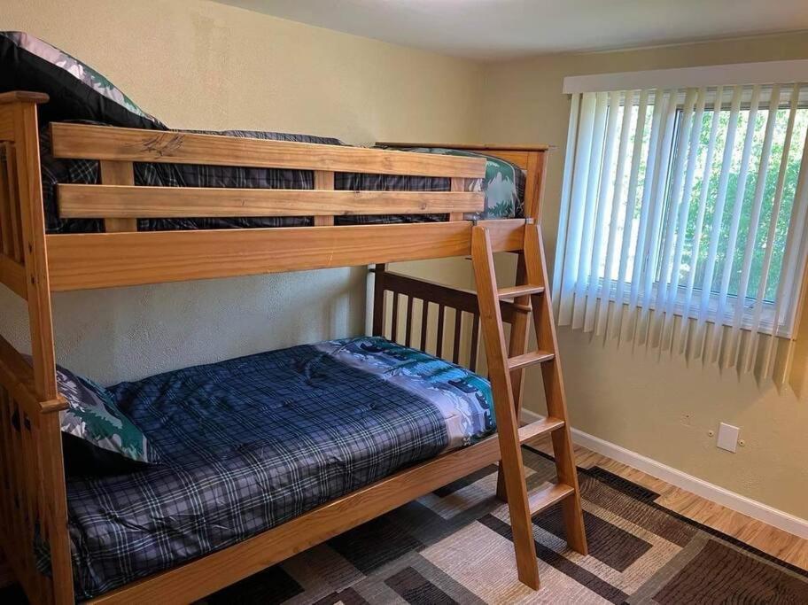 a bunk bed in a room with a bunk bedouble at Nunaka Valley Cottage in Anchorage