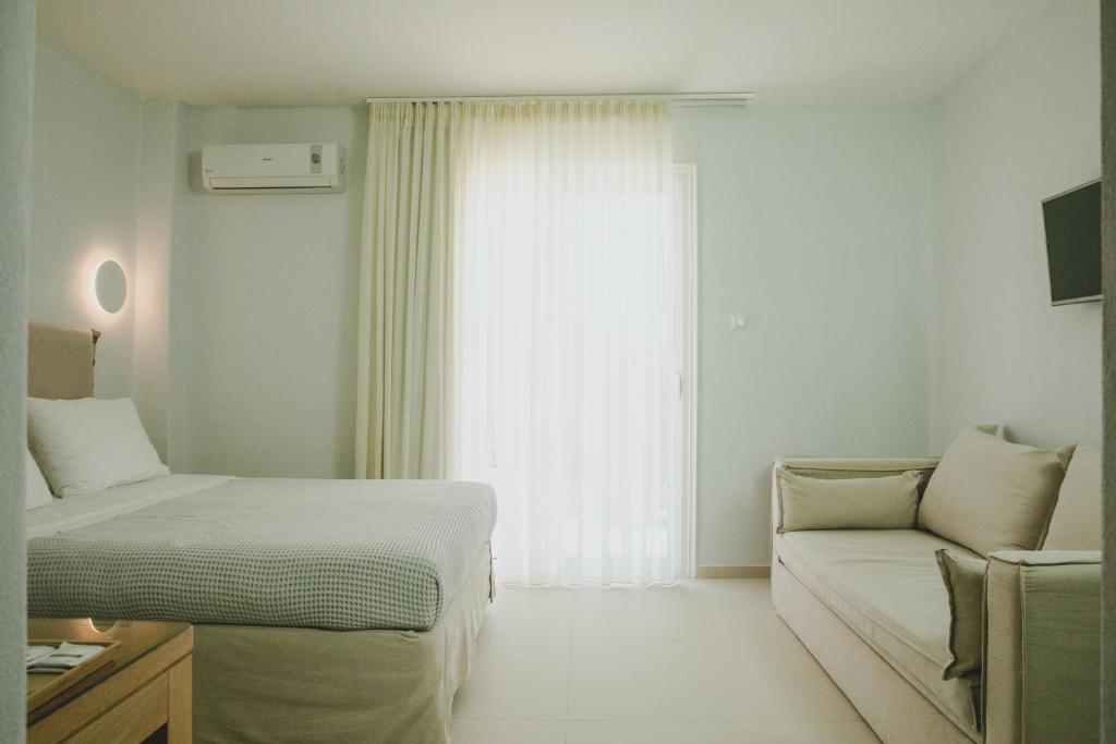 Postel nebo postele na pokoji v ubytování Elektra Comfort Hotel by Del Mare