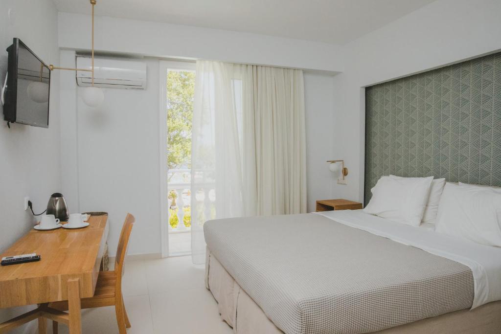 Postel nebo postele na pokoji v ubytování Elektra Comfort Hotel by Del Mare