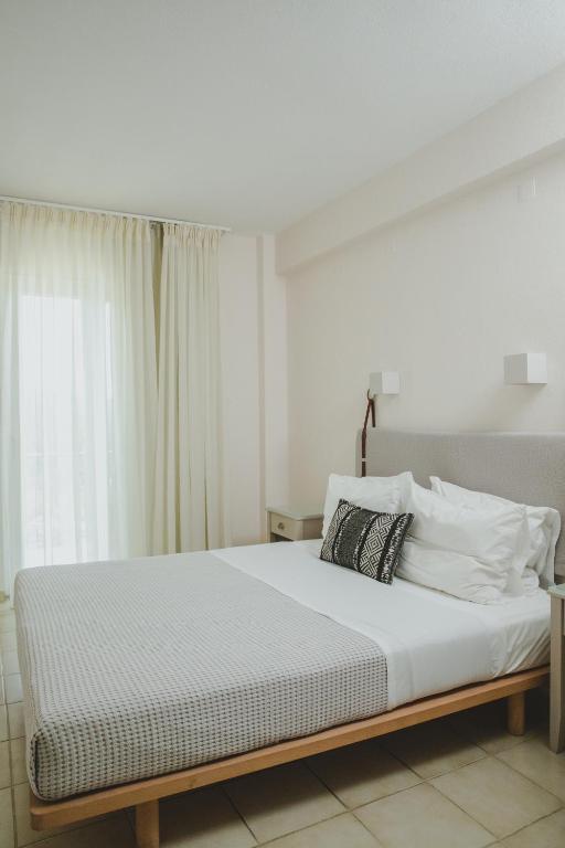 Postel nebo postele na pokoji v ubytování Elektra Comfort Hotel by Del Mare
