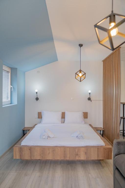 Postel nebo postele na pokoji v ubytování AGH Elite Apartments & Studios