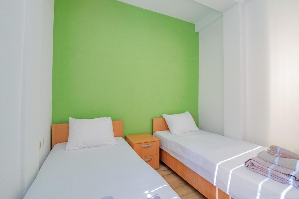 Postel nebo postele na pokoji v ubytování AGH Elite Apartments & Studios
