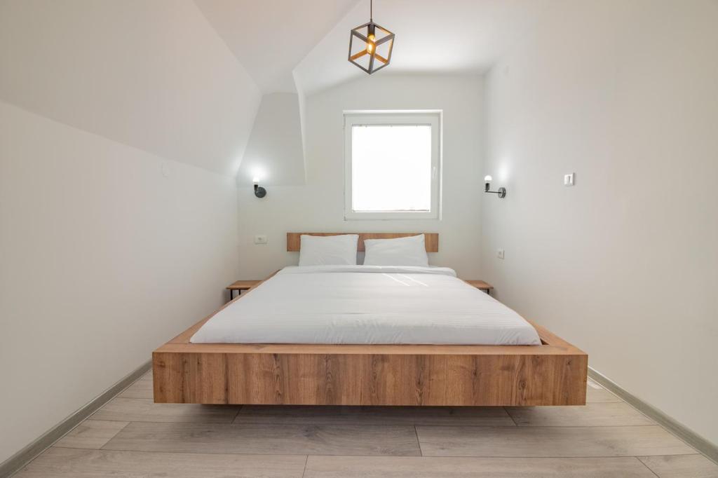 Postel nebo postele na pokoji v ubytování AGH Elite Apartments & Studios