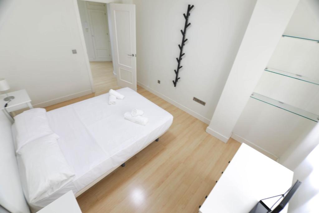 Postel nebo postele na pokoji v ubytování RentalSevilla Génova