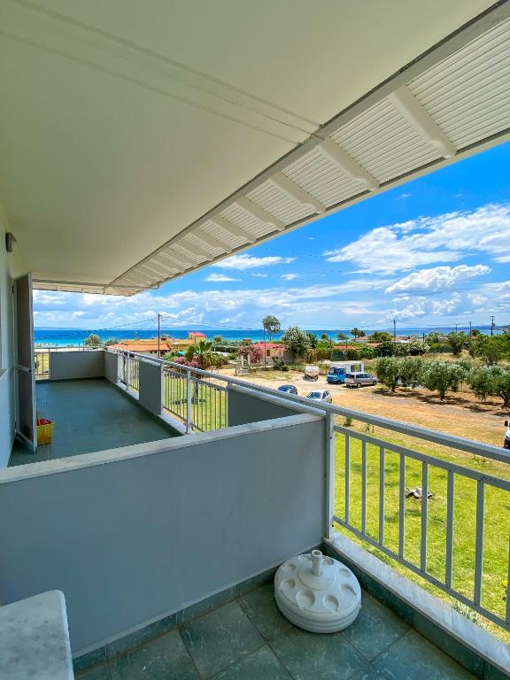 a balcony with a view of the ocean at Seaview Aparthotel in Nea Potidaea