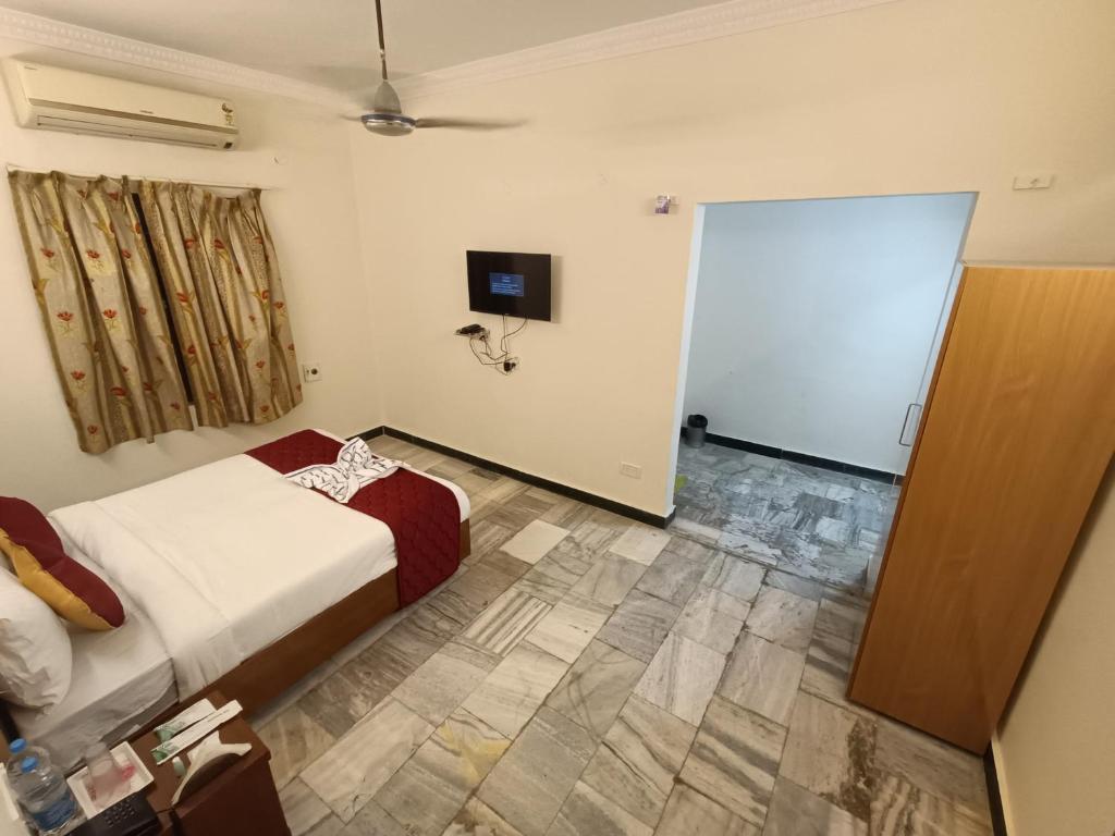 Postel nebo postele na pokoji v ubytování GT Grande Hotel-Near US Consulate