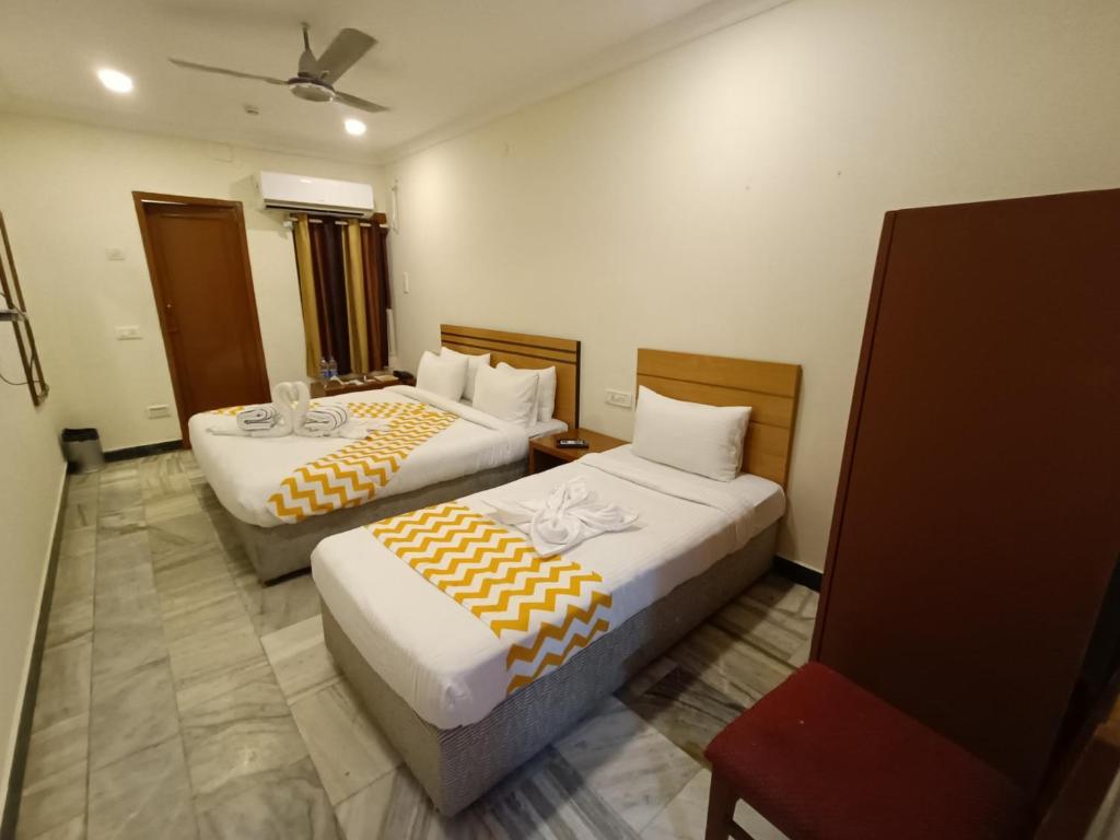 Postel nebo postele na pokoji v ubytování GT Grande Hotel-Near US Consulate