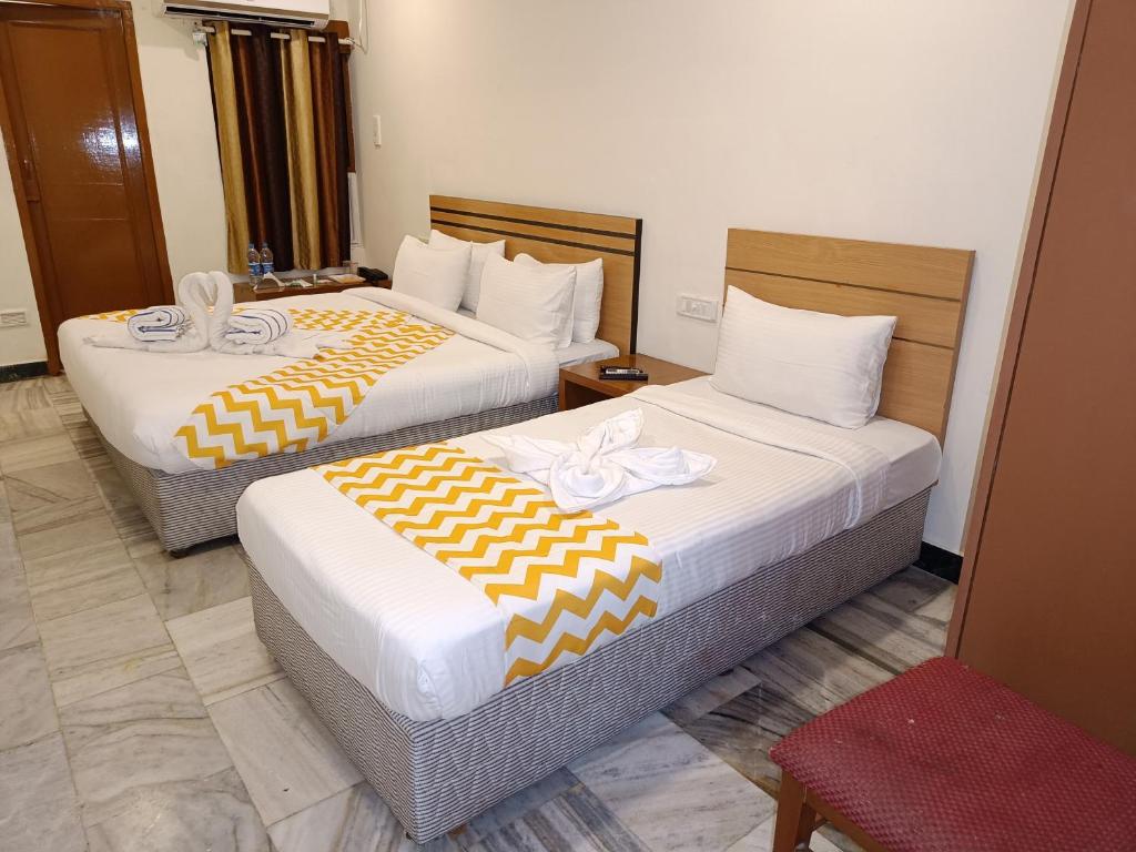 Postel nebo postele na pokoji v ubytování GT Grande Hotel-Near US Consulate