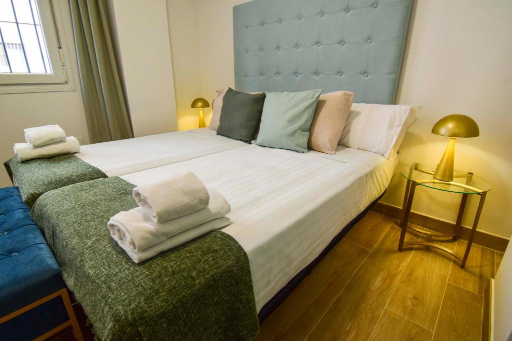 Posteľ alebo postele v izbe v ubytovaní Salitre FreshApartments