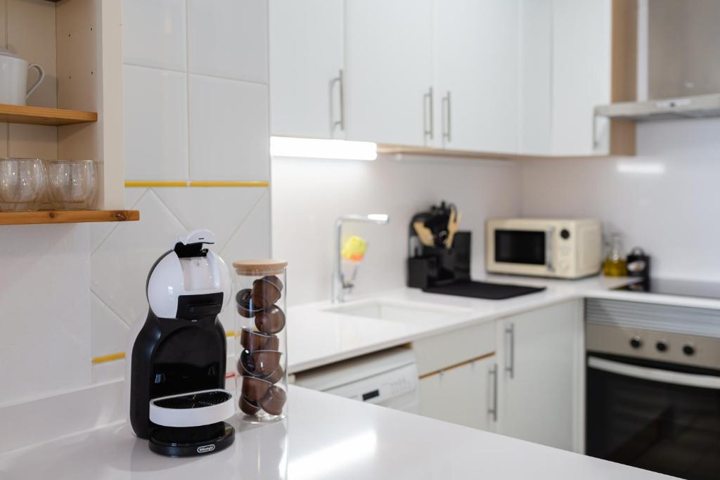 Kuchyň nebo kuchyňský kout v ubytování Apartament Sant Antoni