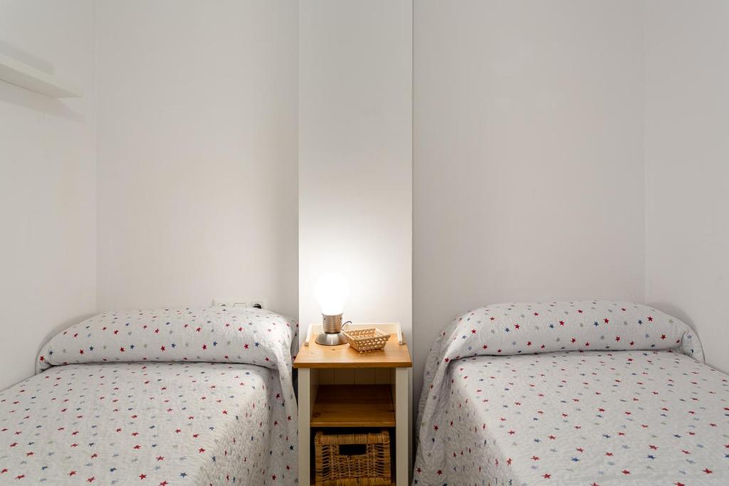 Postel nebo postele na pokoji v ubytování Apartament Sant Antoni