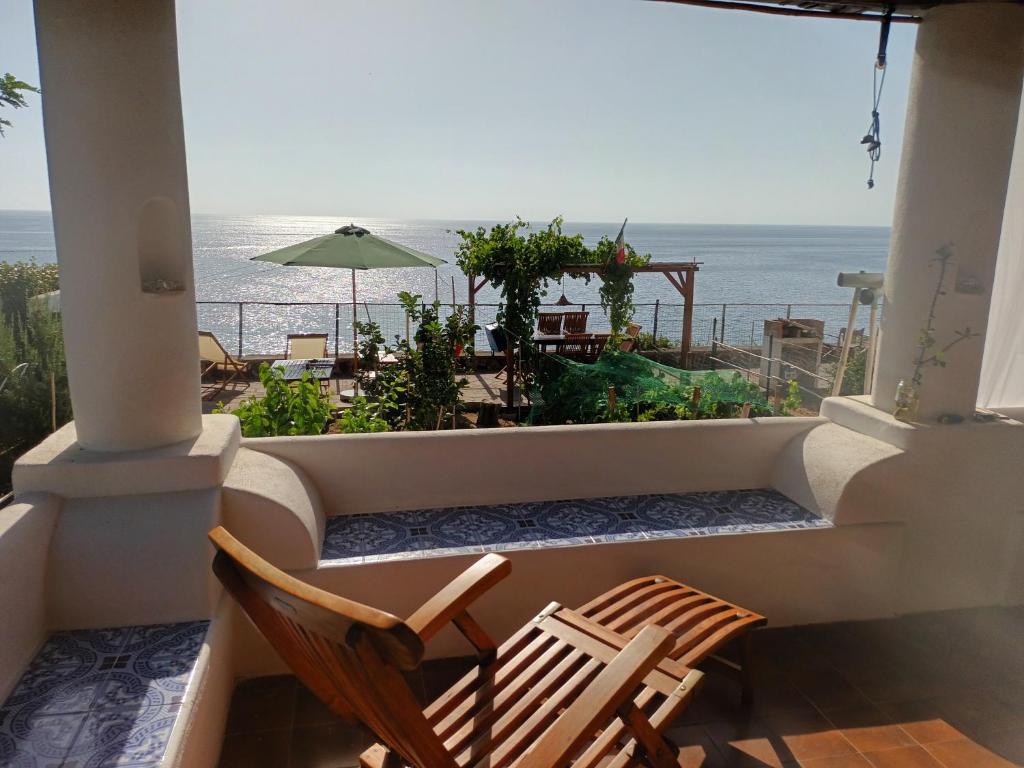 a balcony with two chairs and a view of the ocean at Terrazza sul Mare in Lipari