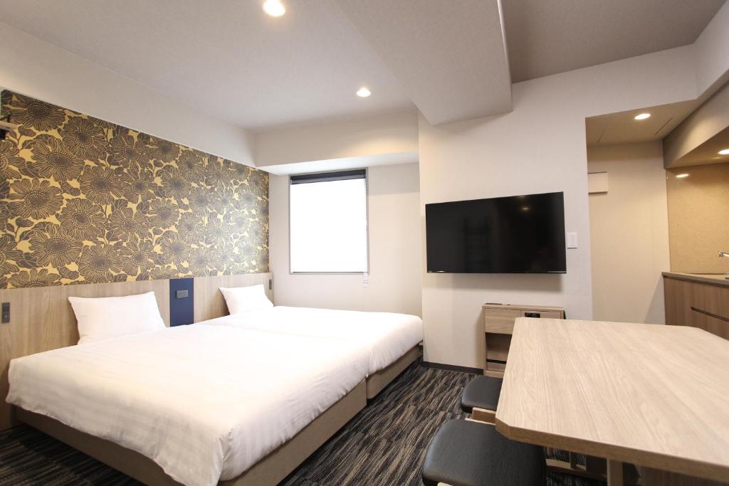 TV a/nebo společenská místnost v ubytování KOKO HOTEL Residence Asakusa Tawaramachi