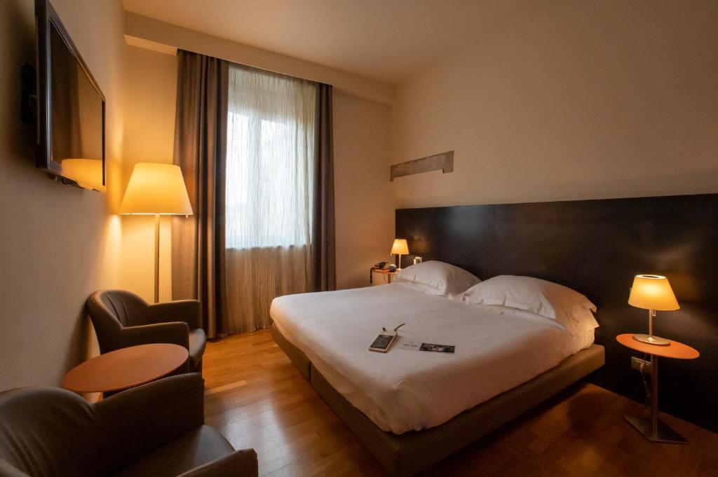 Postel nebo postele na pokoji v ubytování Hotel Annunziata