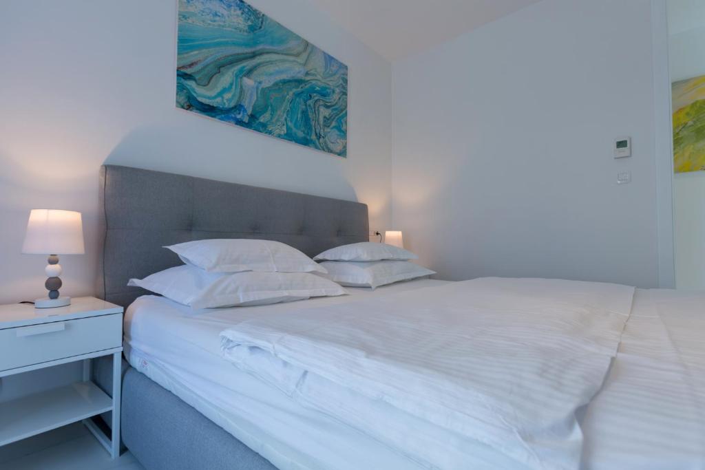 Postel nebo postele na pokoji v ubytování Villa Allegra Luxury Apartments