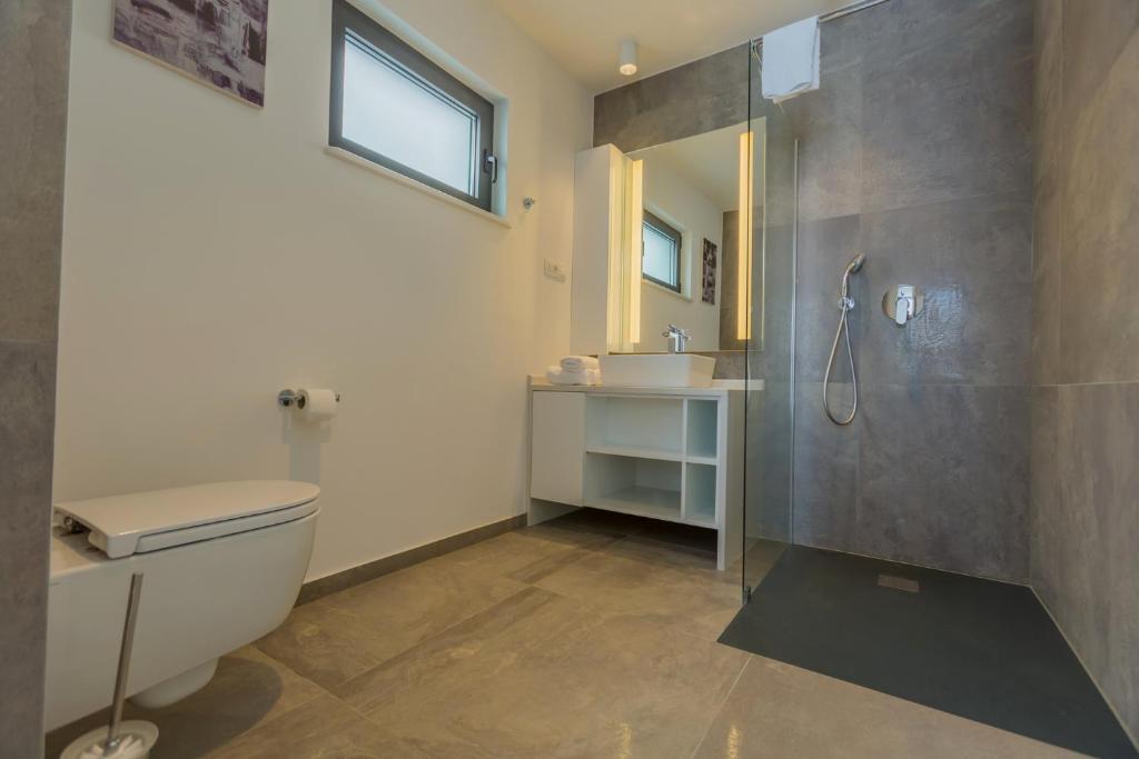 Koupelna v ubytování Villa Allegra Luxury Apartments
