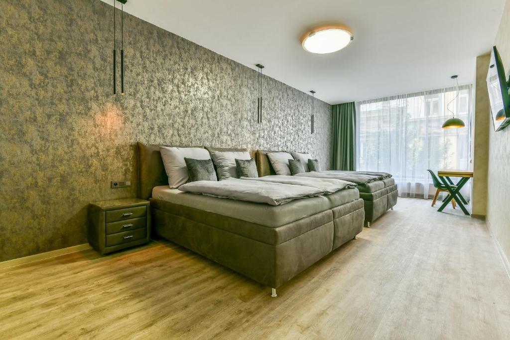Postel nebo postele na pokoji v ubytování Hotel Stračena City