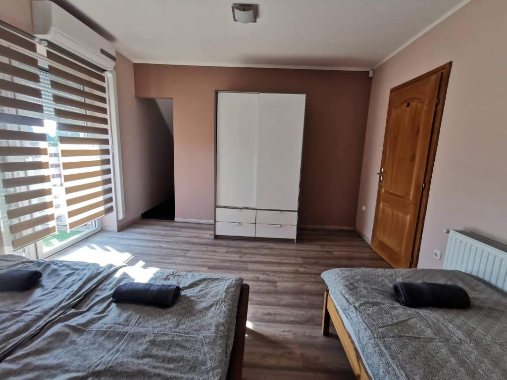 Postel nebo postele na pokoji v ubytování Garden Vendégház Velence
