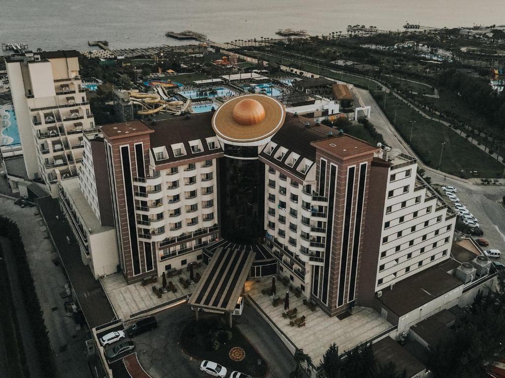 an overhead view of a large building with a gold top at Saturn Palace Resort in Lara