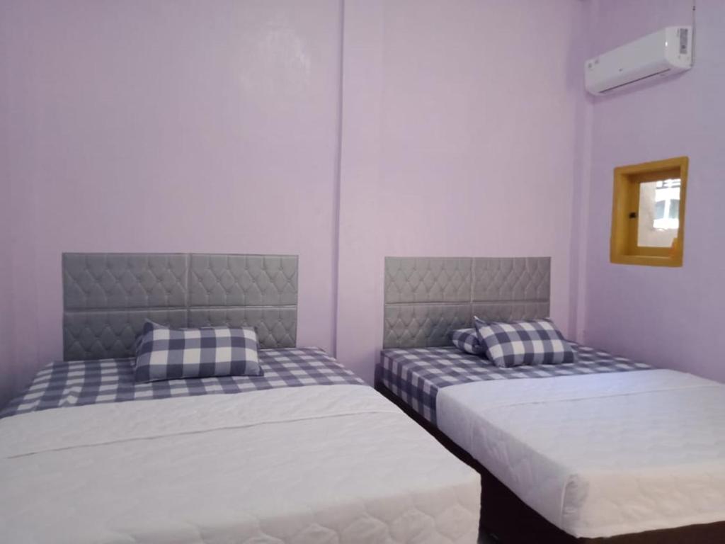 Postel nebo postele na pokoji v ubytování Thalia Homestay & Ijen Bromo Tour