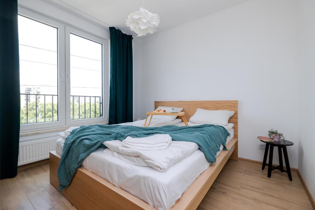 Posteľ alebo postele v izbe v ubytovaní ShortStayPoland Pileckiego
