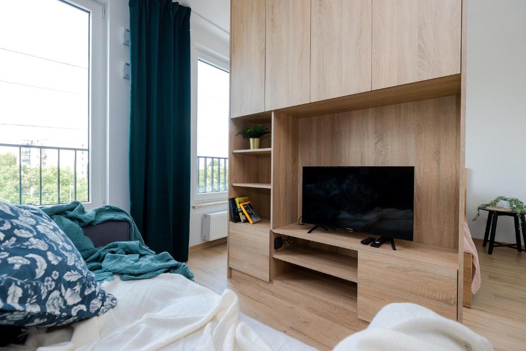 Televízia a/alebo spoločenská miestnosť v ubytovaní ShortStayPoland Pileckiego