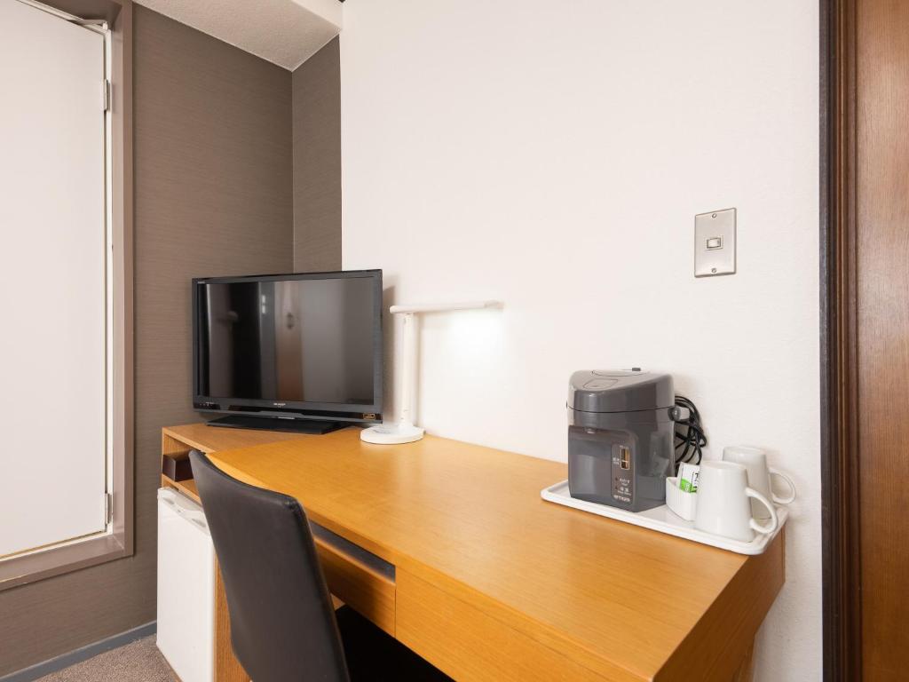 TV a/nebo společenská místnost v ubytování Tabist Hotel New Washington Shibuya