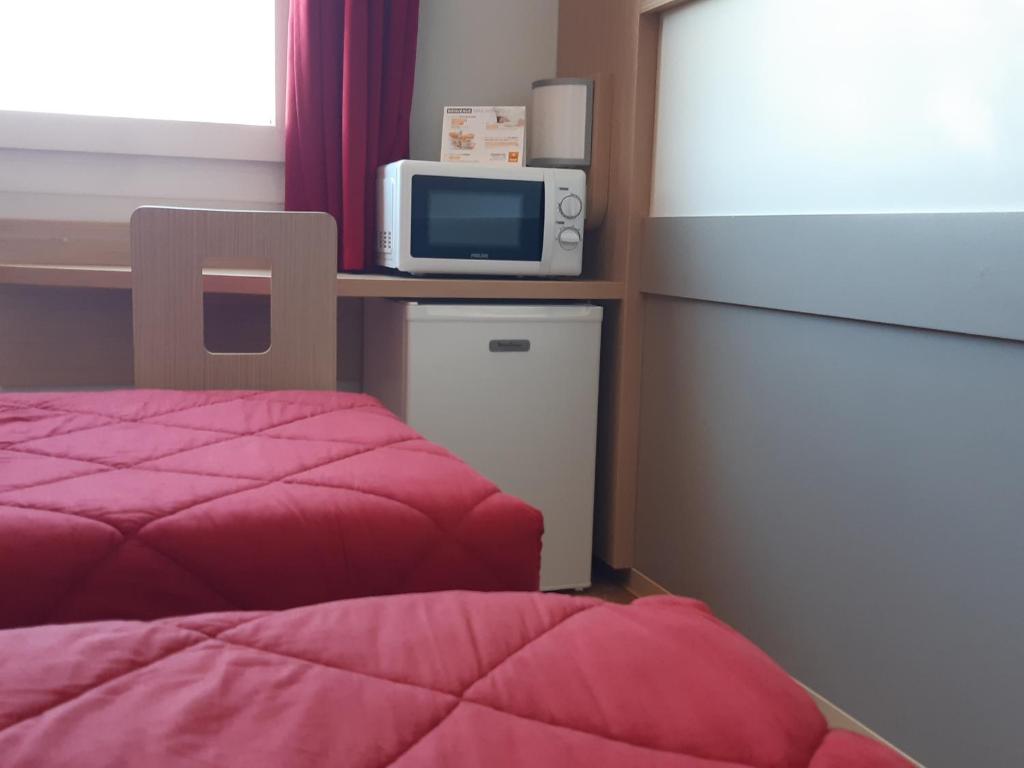 Kuchyň nebo kuchyňský kout v ubytování Premiere Classe Reims Nord - Bétheny