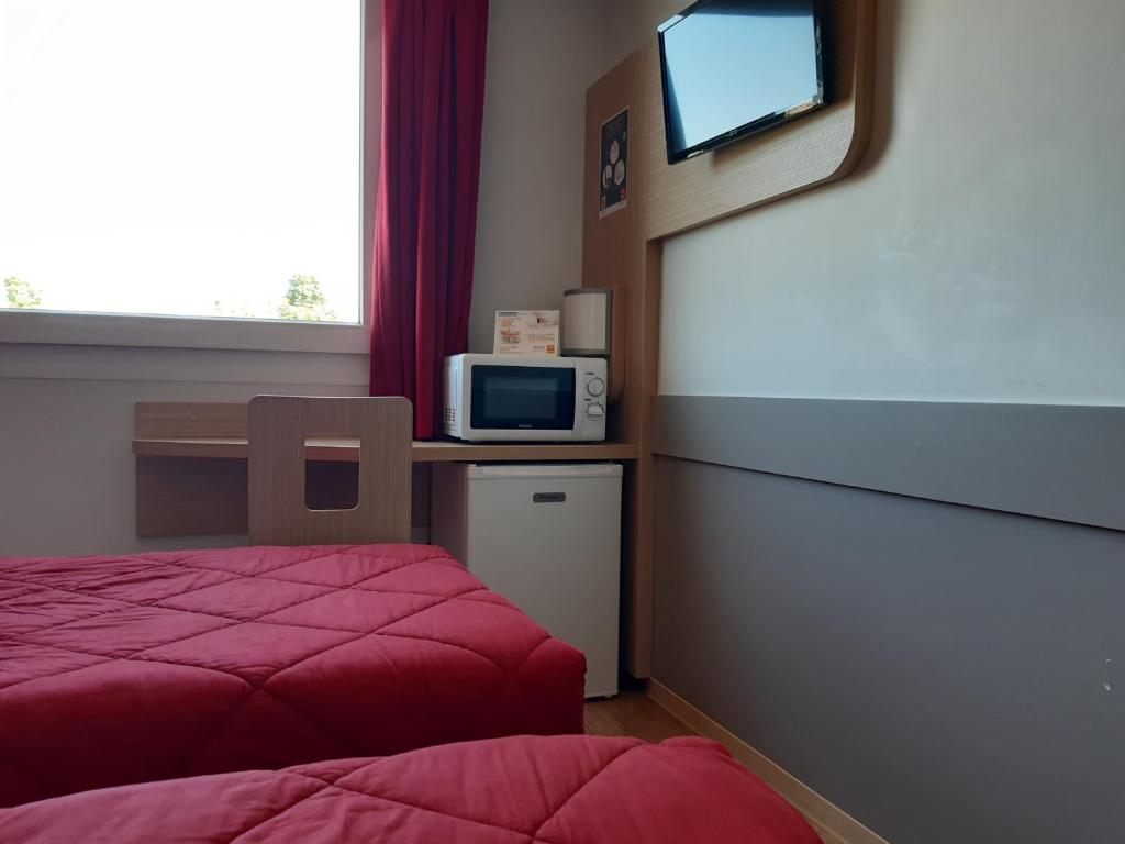 Kuchyň nebo kuchyňský kout v ubytování Premiere Classe Reims Nord - Bétheny