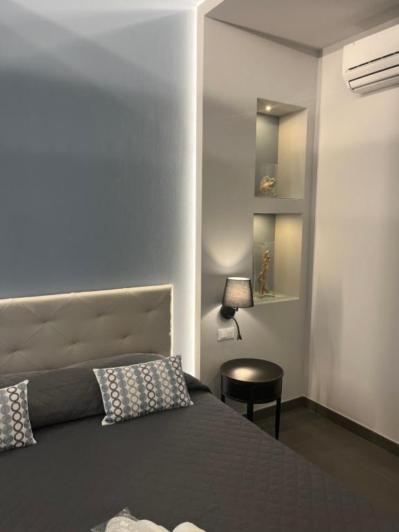 Postel nebo postele na pokoji v ubytování Hotel Il colle di Monterosso