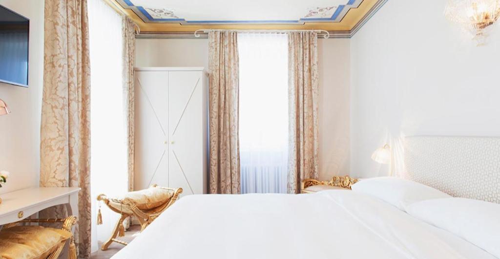 Postel nebo postele na pokoji v ubytování Boutique Hotel Villa Sarnia