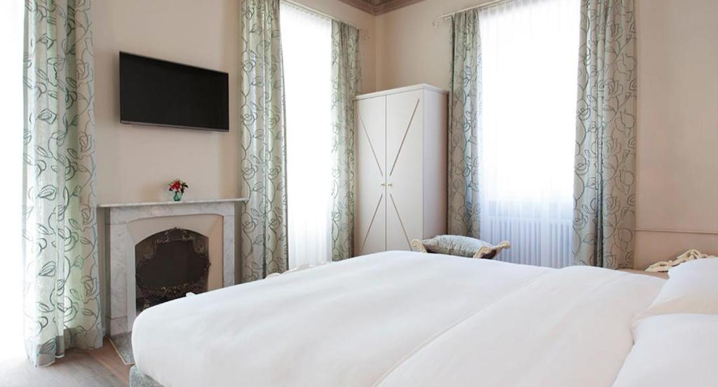 Postel nebo postele na pokoji v ubytování Boutique Hotel Villa Sarnia