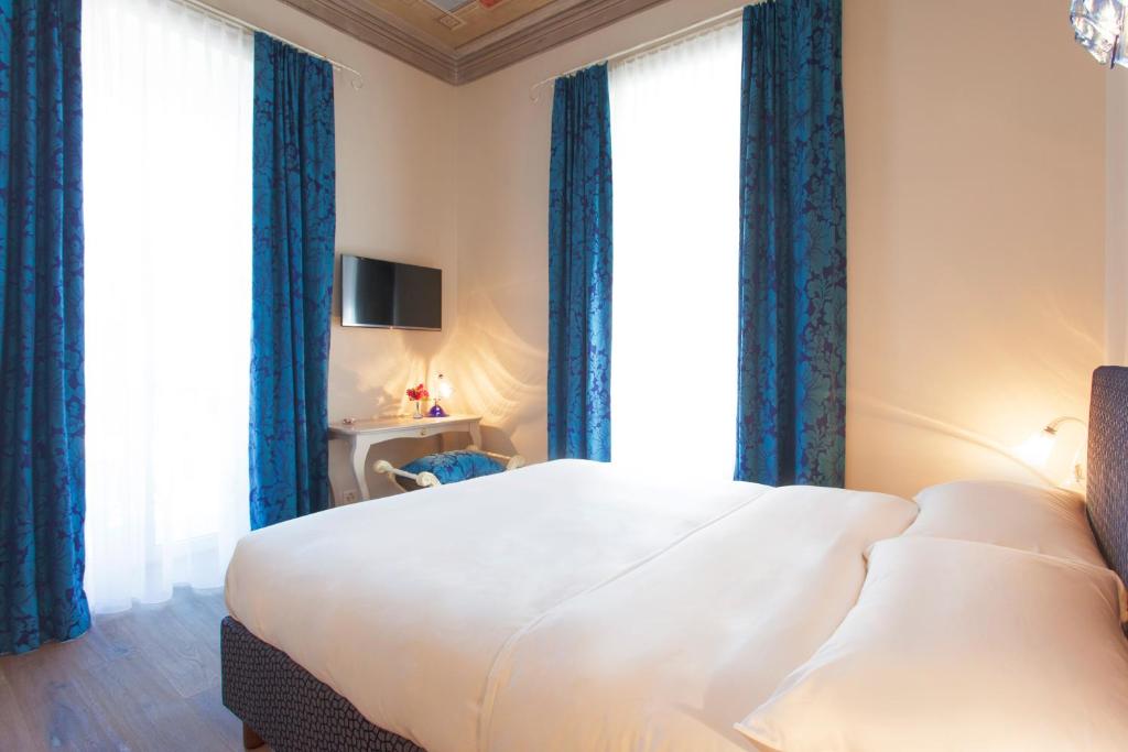 Postel nebo postele na pokoji v ubytování Boutique Hotel Villa Sarnia