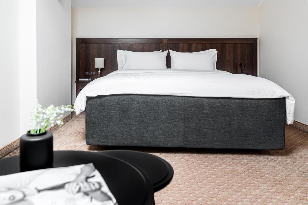 Lova arba lovos apgyvendinimo įstaigoje Kerpė Hotel & SPA