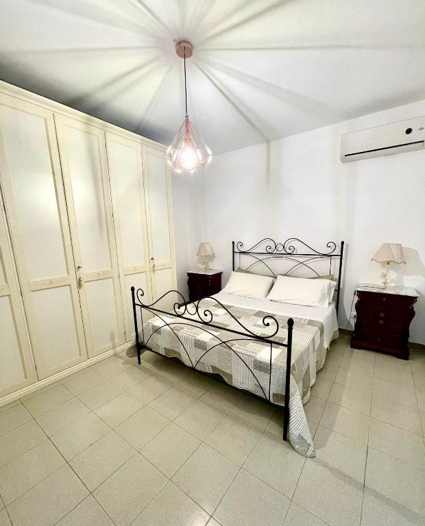 Postel nebo postele na pokoji v ubytování Villa Priscilla