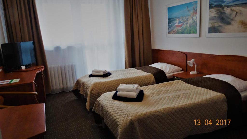 Postel nebo postele na pokoji v ubytování San Medical Spa