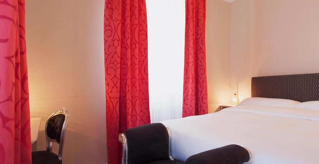 Postel nebo postele na pokoji v ubytování Boutique Hotel Villa Sarnia