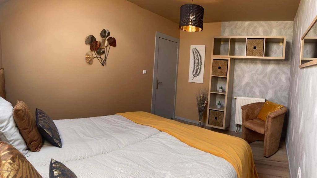 Postel nebo postele na pokoji v ubytování LE COTTAGE