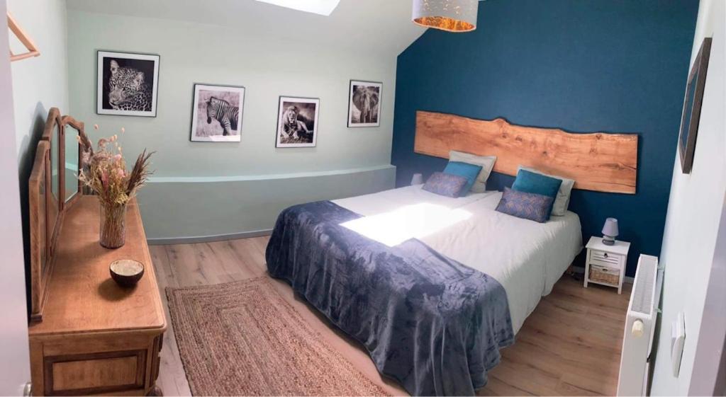 Postel nebo postele na pokoji v ubytování LE COTTAGE