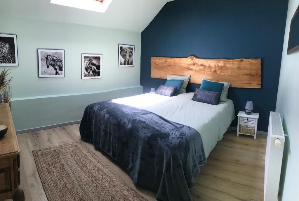 Postel nebo postele na pokoji v ubytování LE COTTAGE