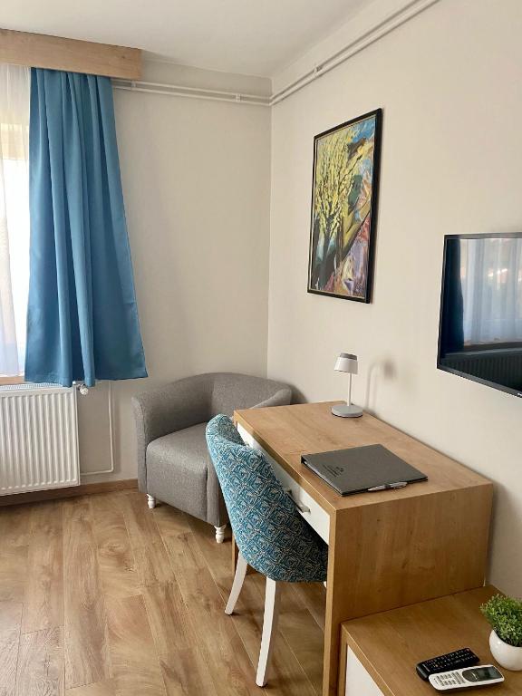TV a/nebo společenská místnost v ubytování Grand Park rooms & apartments