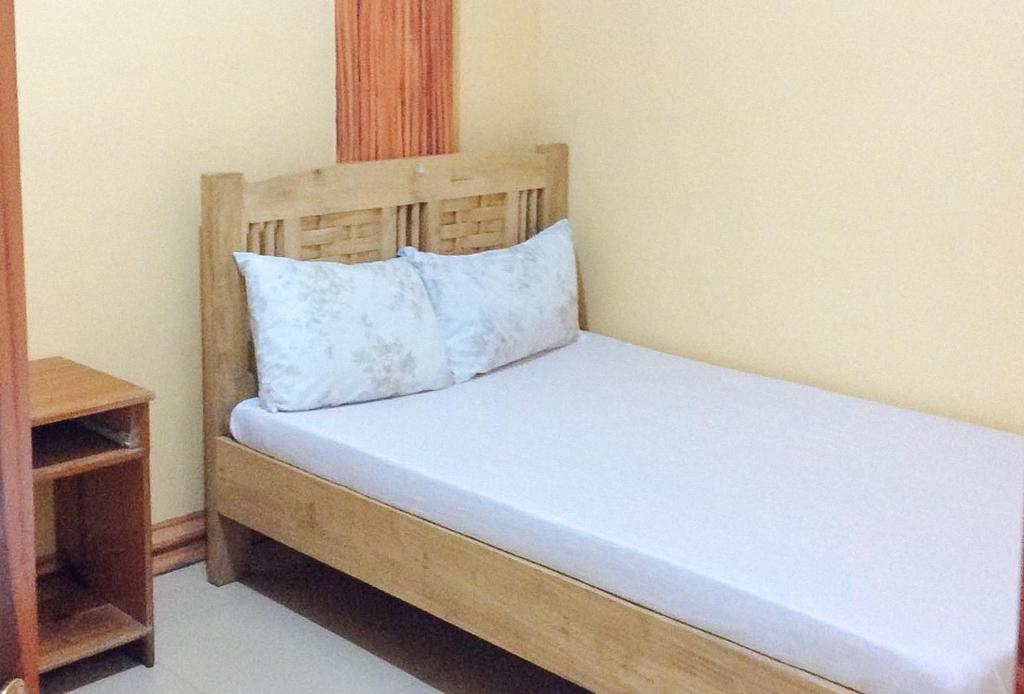 Postel nebo postele na pokoji v ubytování RedDoorz Hostel at Baguio Tourist Cabin