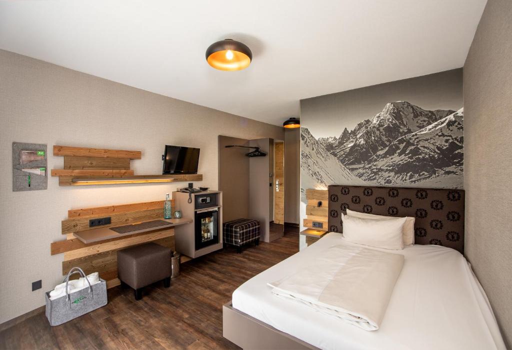 Postel nebo postele na pokoji v ubytování Arcus Hotel München Messe
