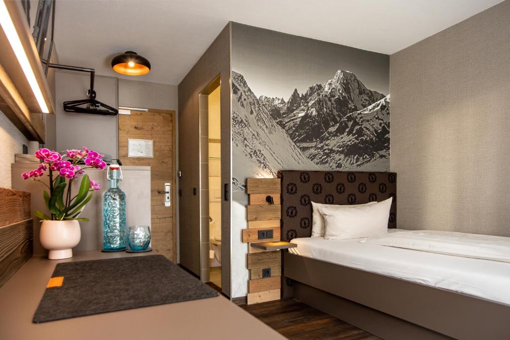 Postel nebo postele na pokoji v ubytování Arcus Hotel München Messe