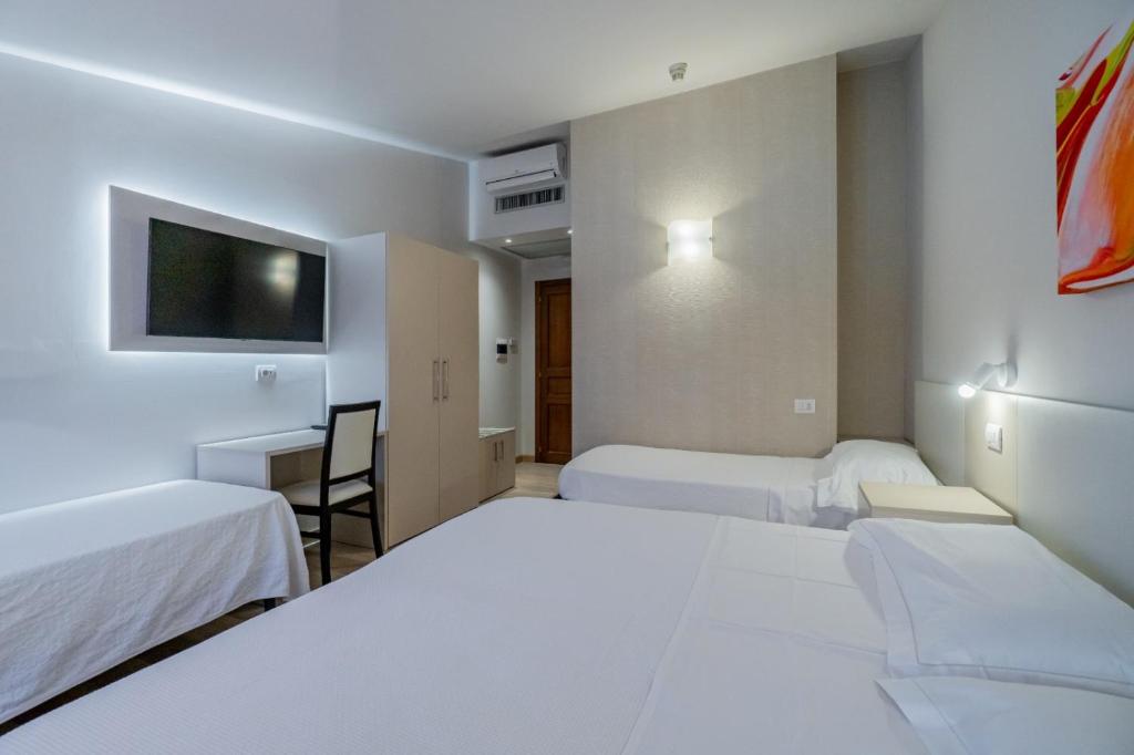 Postel nebo postele na pokoji v ubytování Hotel Bellavista