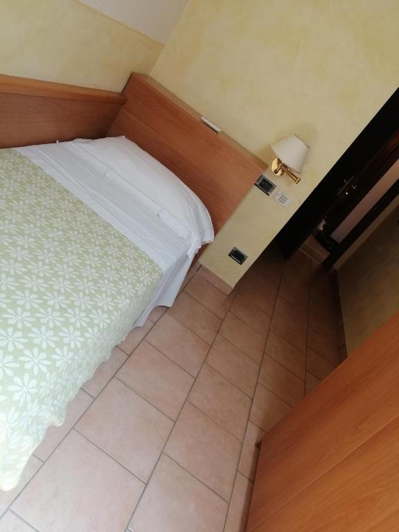 Postel nebo postele na pokoji v ubytování Hotel Bellavista