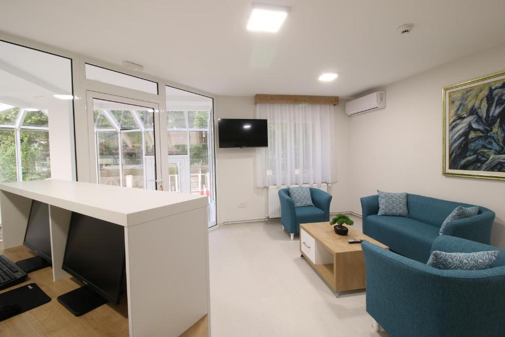 TV a/nebo společenská místnost v ubytování Grand Park rooms & apartments
