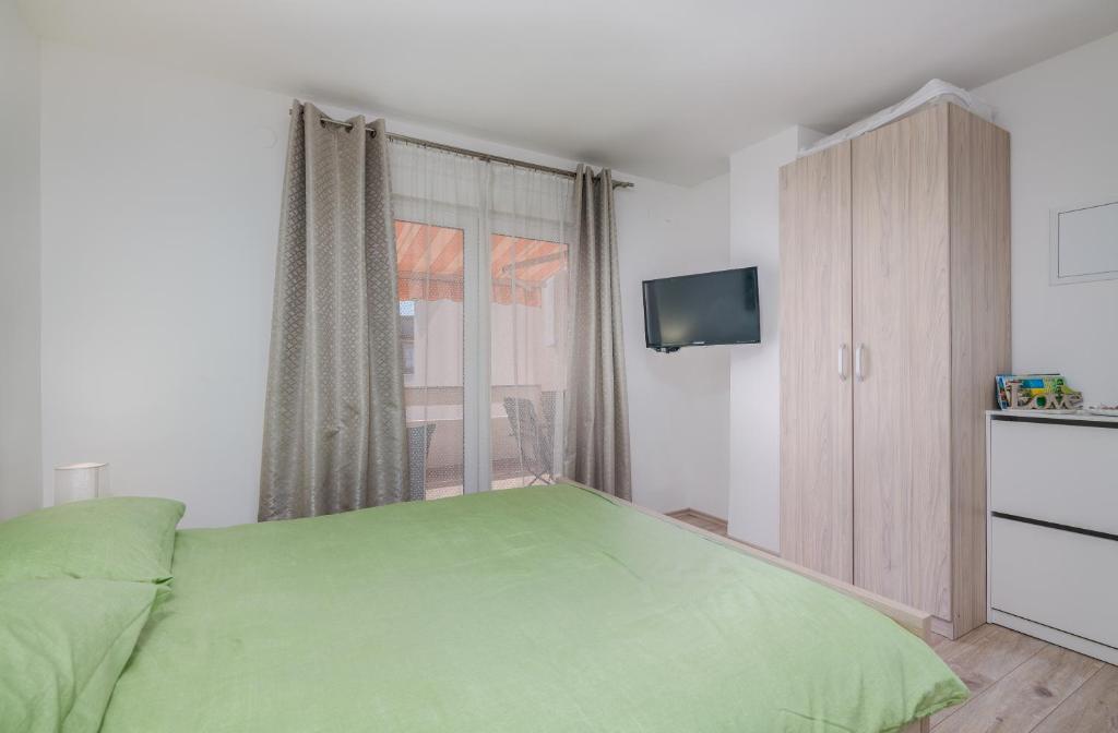 Posteľ alebo postele v izbe v ubytovaní Apartment Stella di Mare